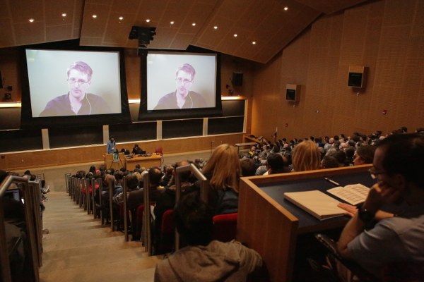 Edward Snowden on the screen talking with Daniel Kahn Gillmore at LibrePlanet 2016